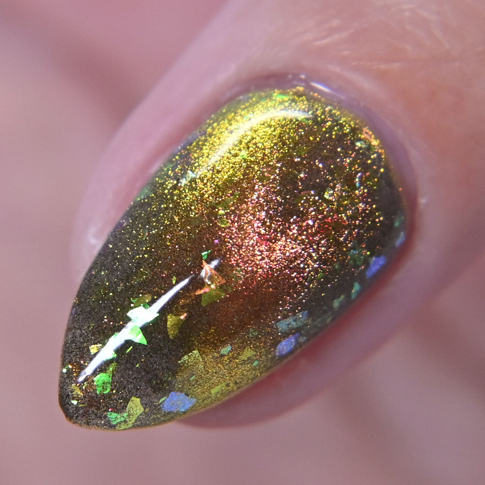 Close-up of a nail with multichrome magnetic glittery polish