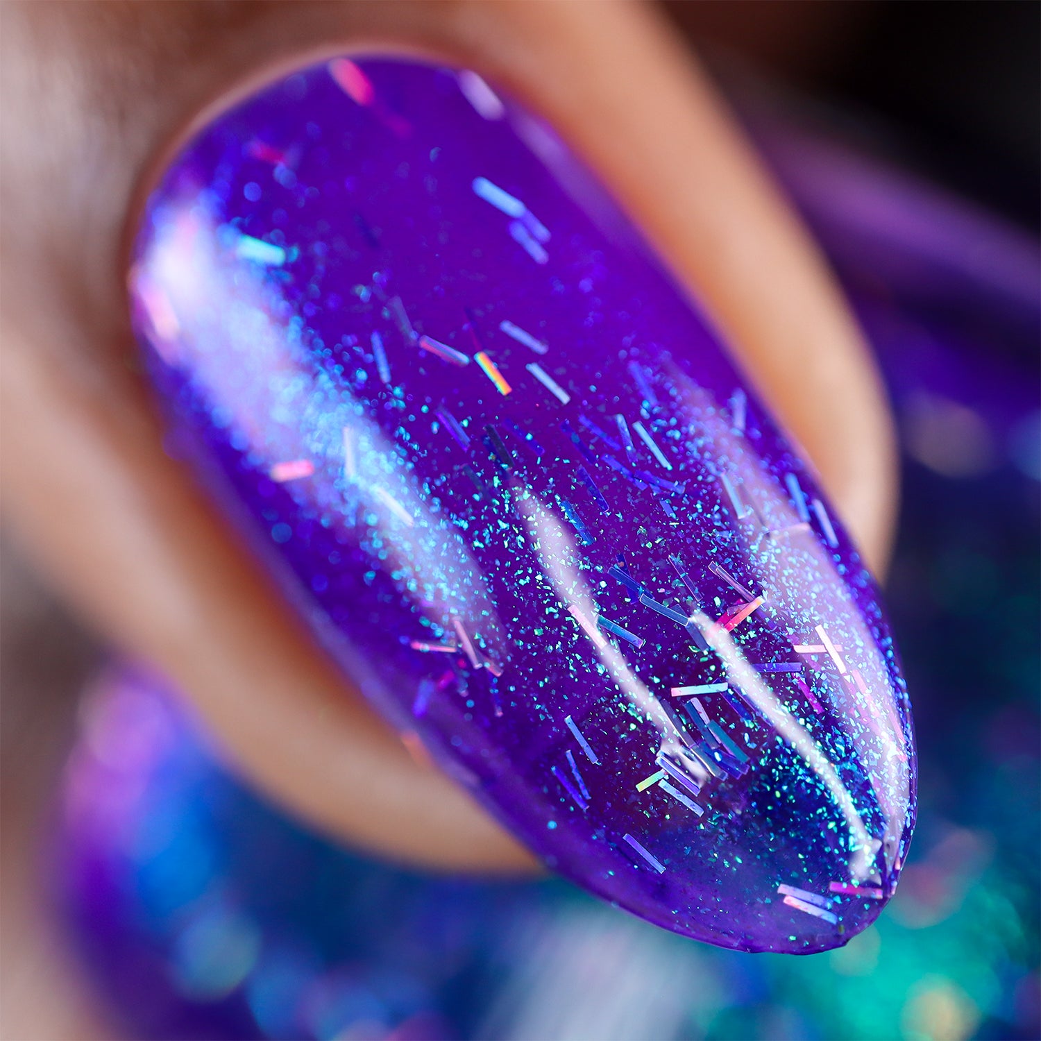 Close-up of a purple nail with glittery finish