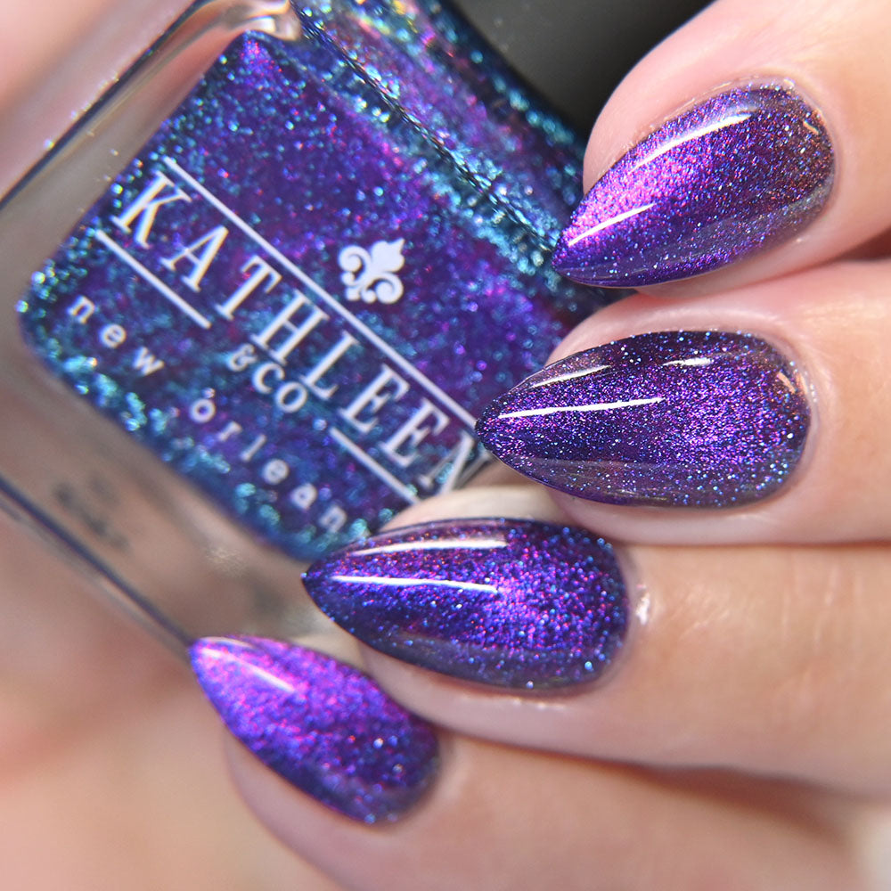 Purple glittery magnetic nails with a bottle of kathleen &amp; co  nail polish.