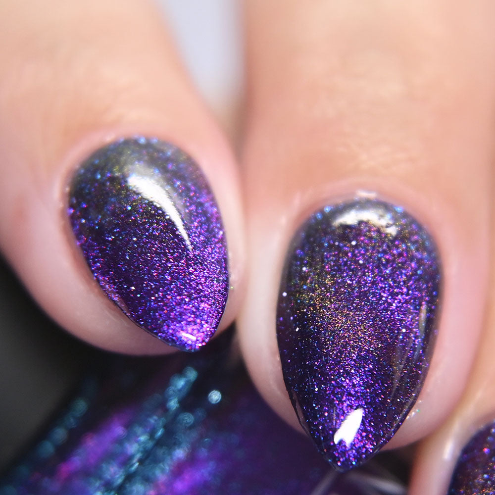 Close-up of a hand with purple kathleen 7 co glittery nail polish