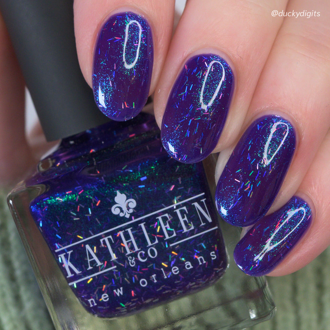 kathleen &amp; co new orleans Nail polish bottle with purple glittery nails