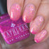Pink thermal nails with a bottle of Kathleen & Co New Orleans nail polish.