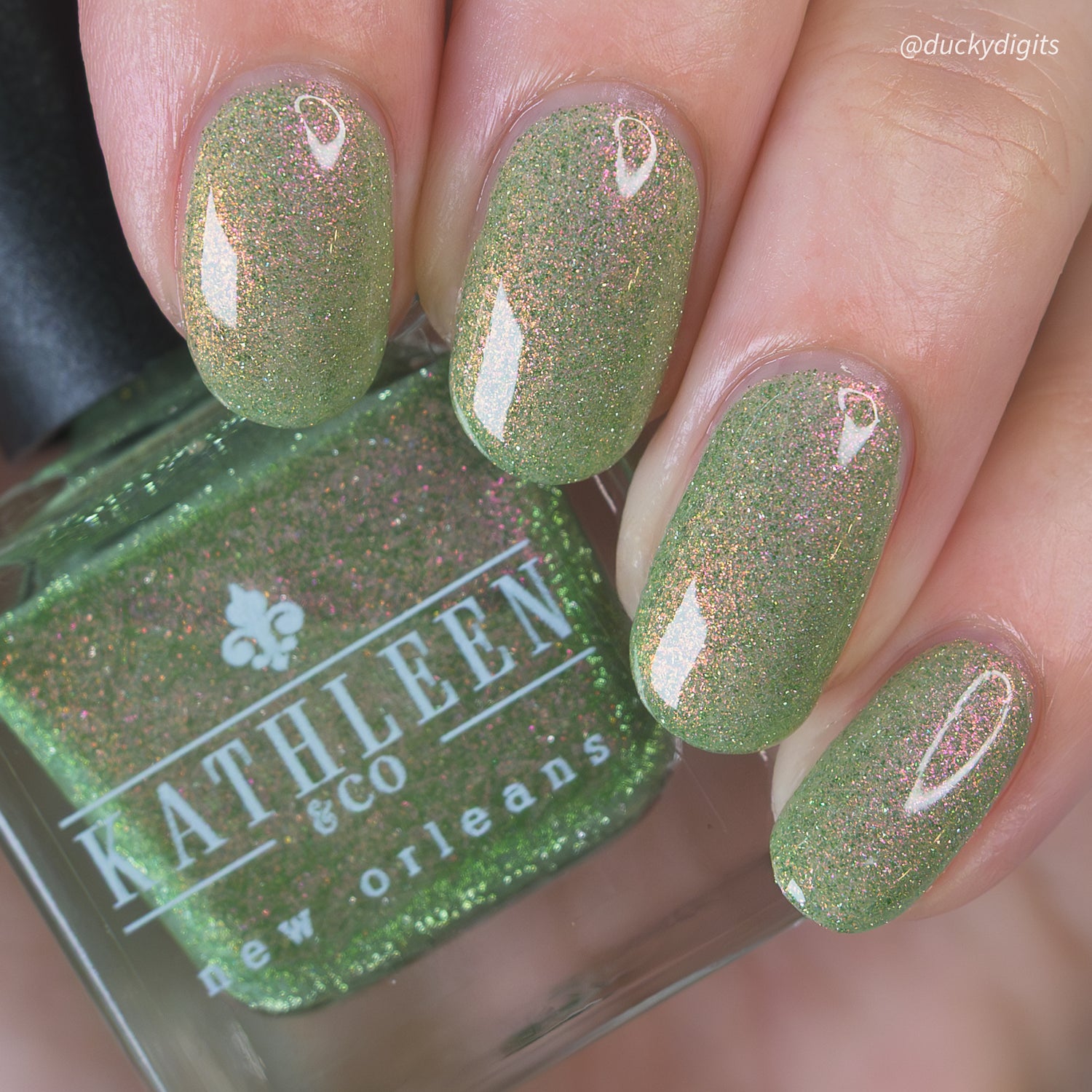 Green refelctive glitter nail polish with &