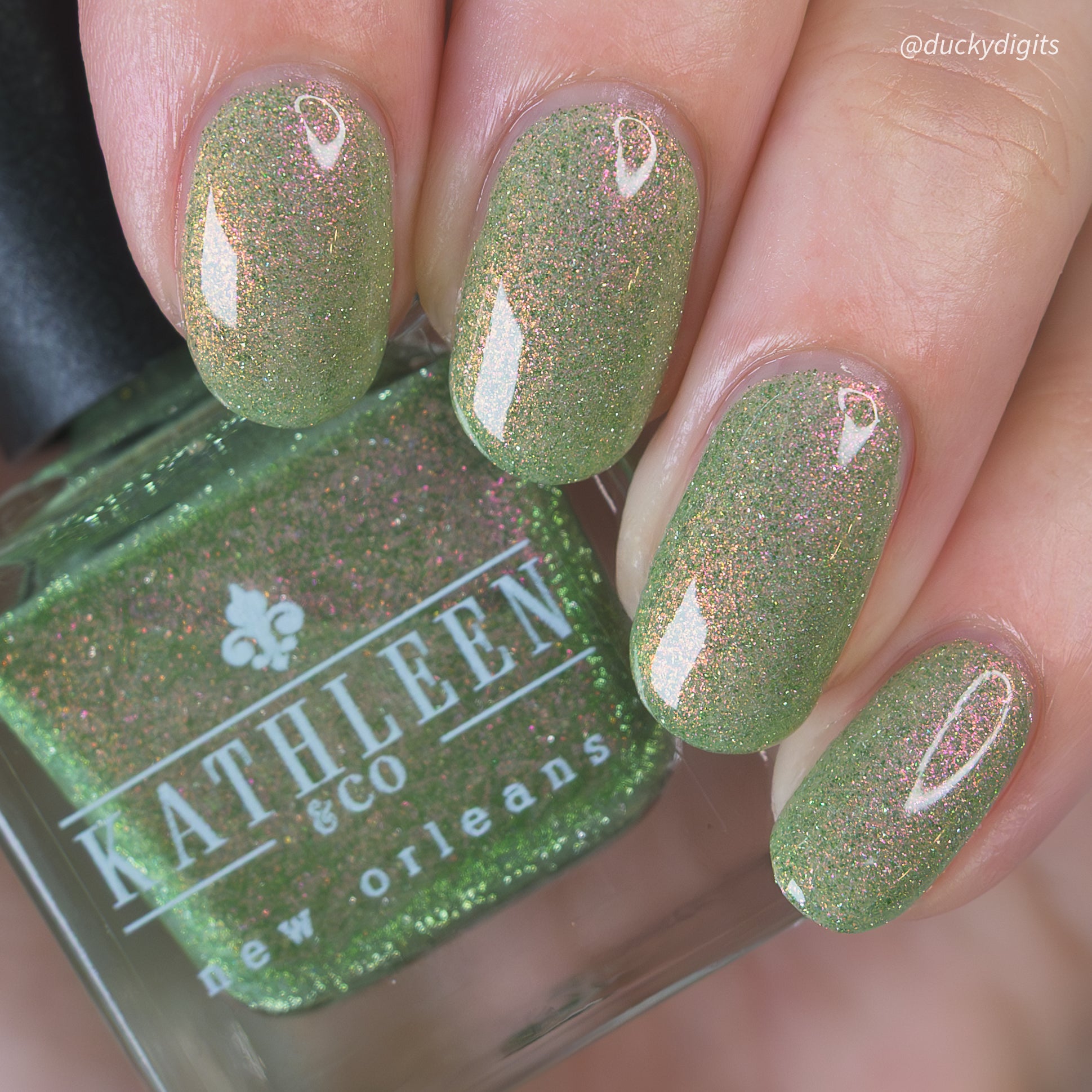 Green refelctive glitter nail polish with &