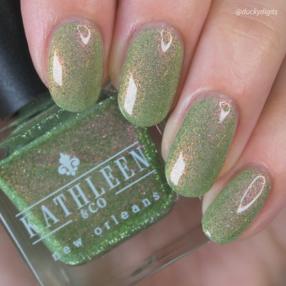 Green refelctive glitter nail polish with &